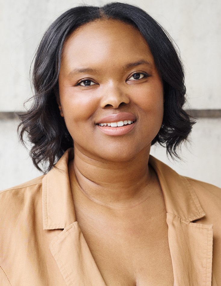 Headshot in tan blazer
