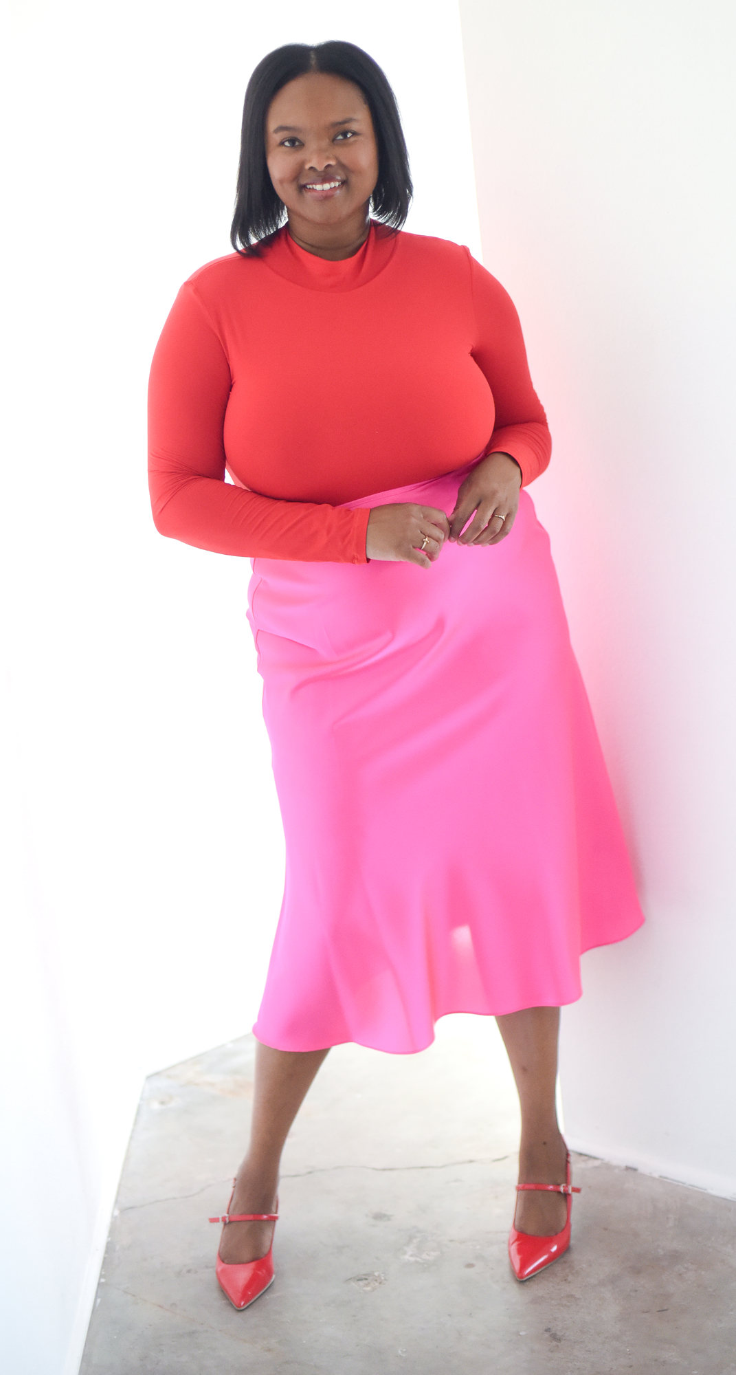 Kimberly Trubetskoy — red top and pink skirt lifestyle — Lifestyle — Denver